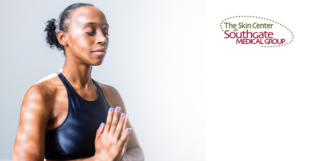 SOUTHGATE_SKIN_CENTER_PREVENTATIVE_BOTOX Preventative Botox: A young woman closes her eyes and presses her hands together in a yoga health position.