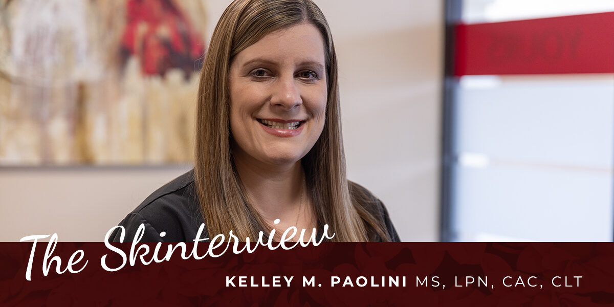 Kelley Paolini_Skin Center The Skinterview: Kelley M. Paolini. A blonde woman, a medical professional, smiles in the lobby of The Skin Center
