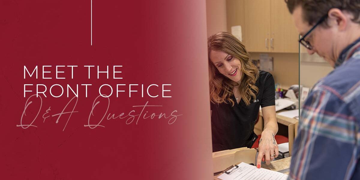 The Skin Center – Meet Jillian Jonathan The Skin Center: TEXT: Meet the front office: Q&A Questions. IMAGE: Jillian Jonathan, a skin care expert and woman with dirty blonde hair and a black shirt, advises a male skin care customer at a receptionist's window inside a skin center.